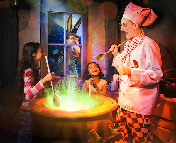 A scene fro Shrek's Adventure with Donkey, chef and children 